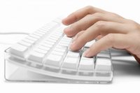 Typing on a white keyboard